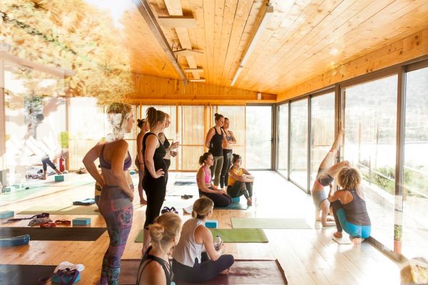 Joanna and student in scorpio pose