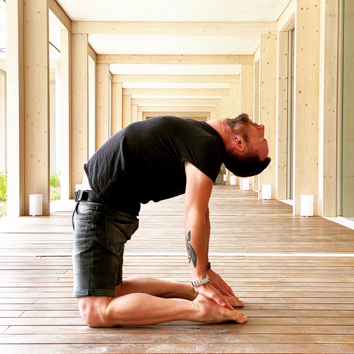 Martin Sittek doing Camel pose