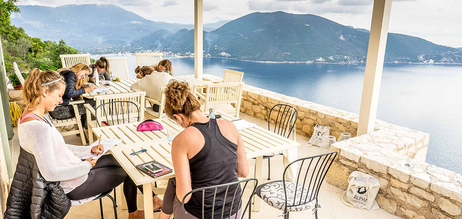 students studying on the terrace during the Yoga Teacher Training