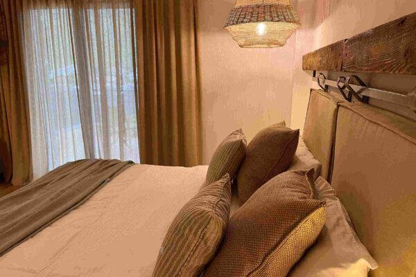 IMG_0530 (2)_11zon a bedroom with brown pillows